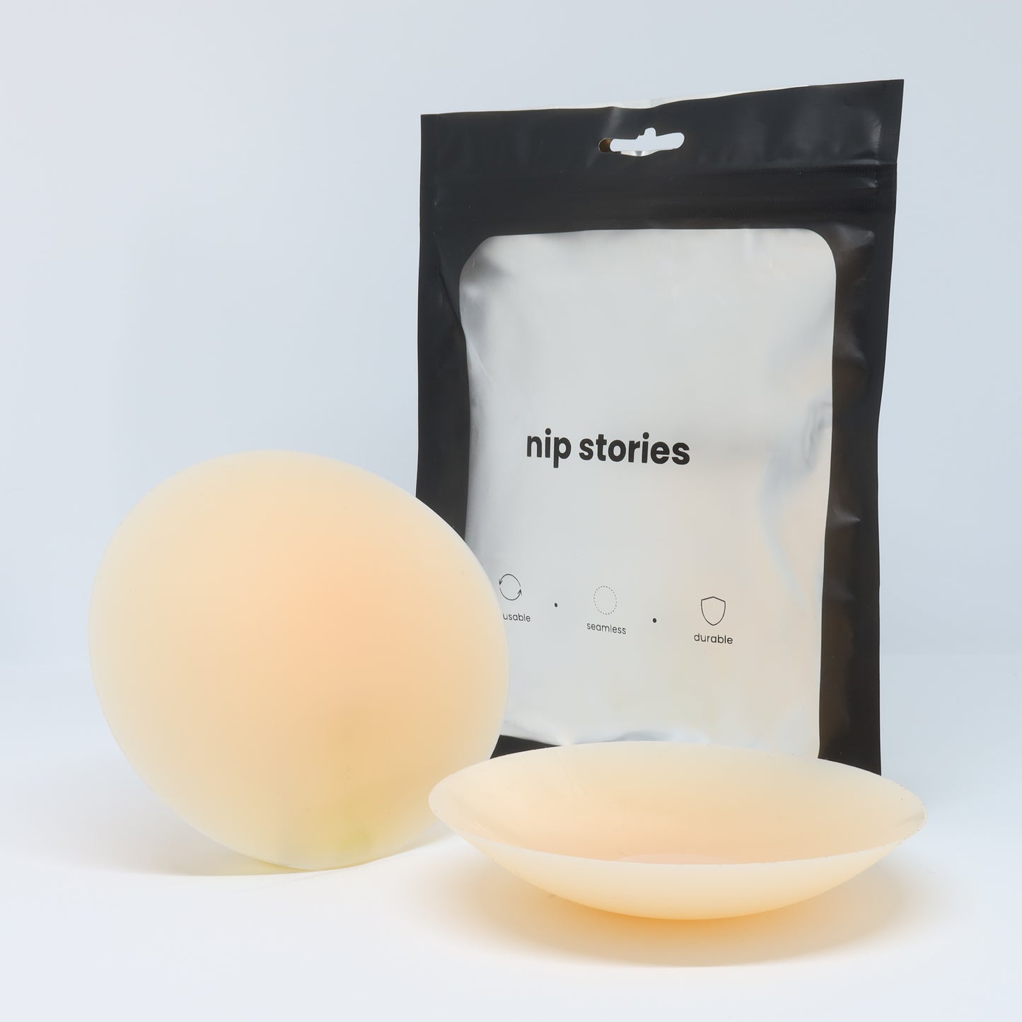 front view of nip stories 10 cm light adhesive nipple covers in nz
