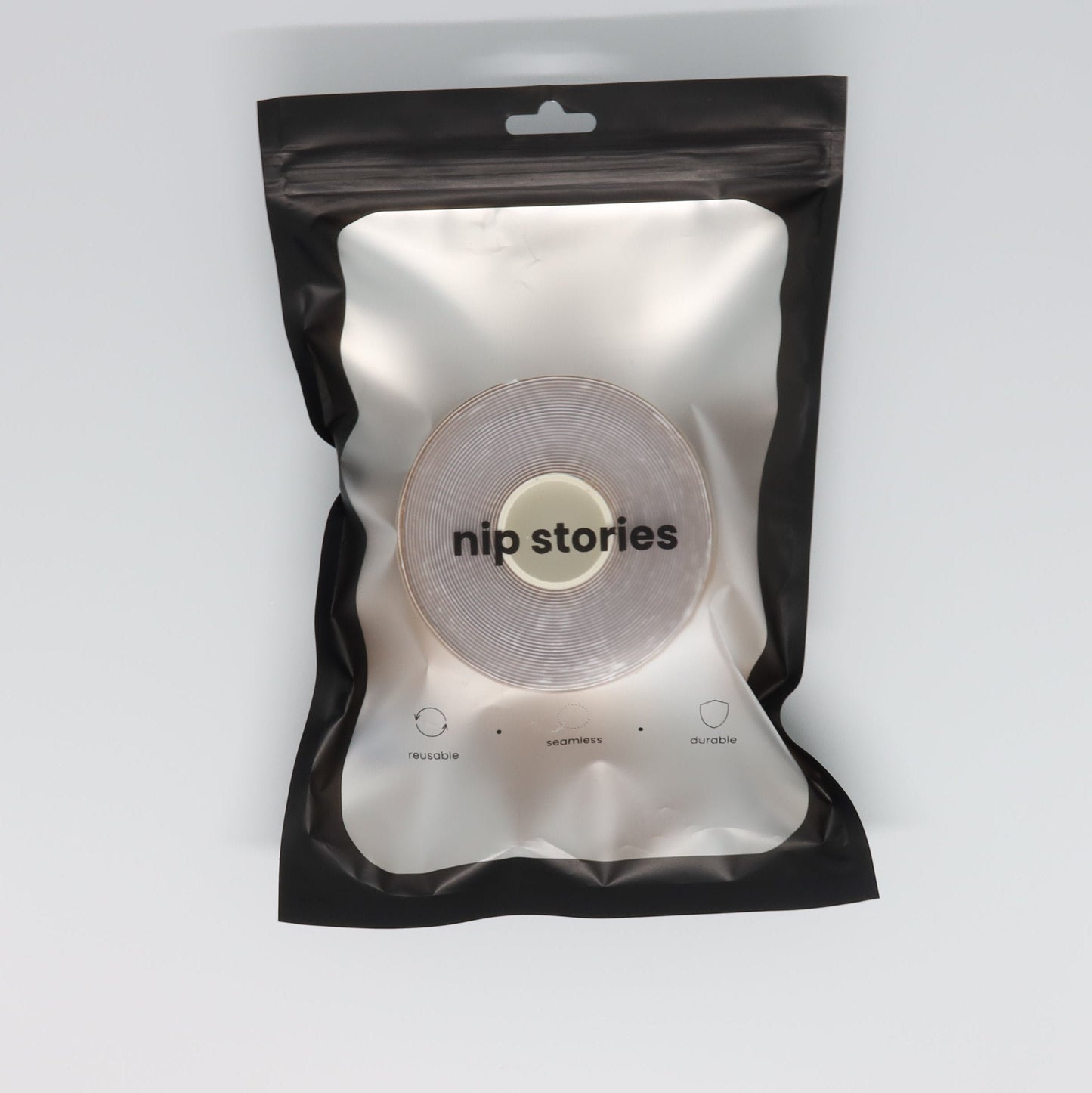 top view of nip stories boob tape in packaging