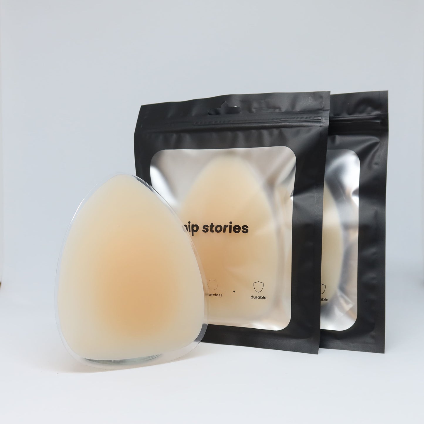 2 pairs on nip stories non adhesive triangle nipple covers against a white background