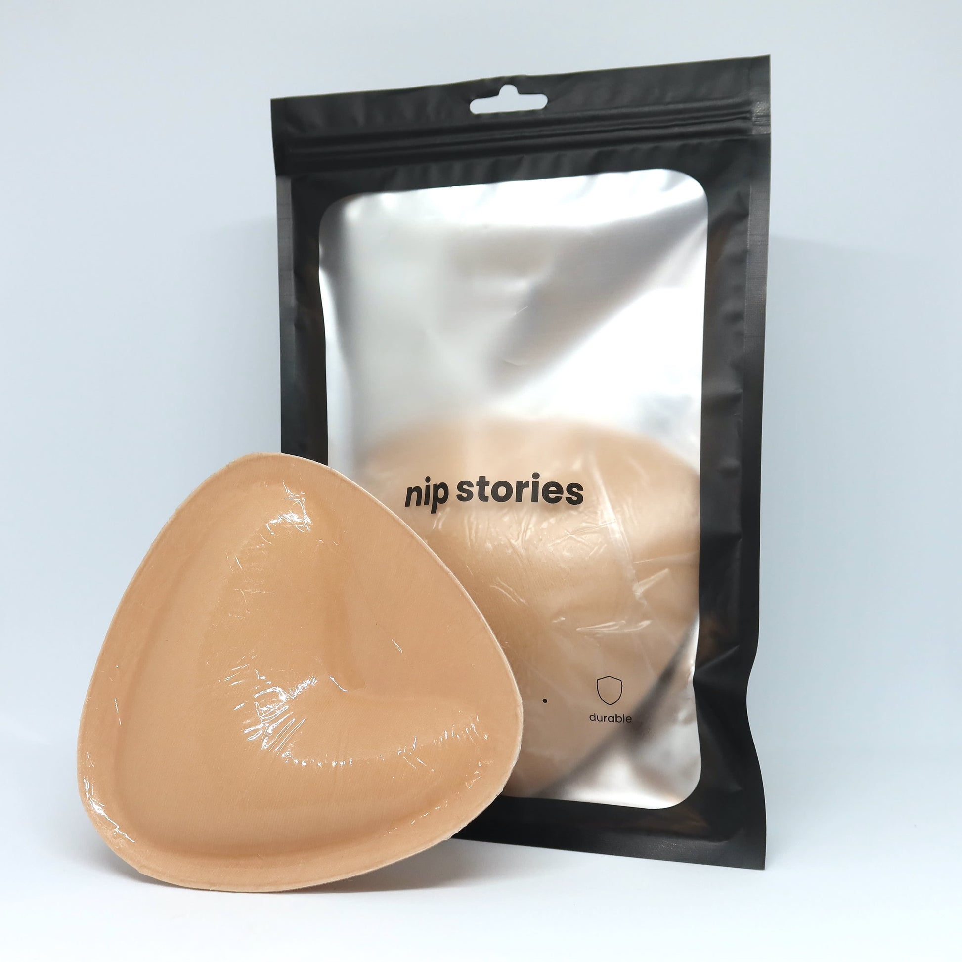 nip stories large bra inserts in front of packaging on a white background